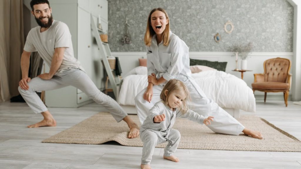 A joyful family engaging in morning stretches together, fostering a fun and healthy routine.