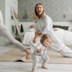 A joyful family engaging in morning stretches together, fostering a fun and healthy routine.